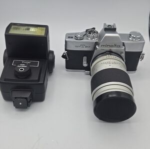 Minolta SR-T 201 Silver and Black 35mm SLR with Telephoto Lens and Vivitar Flash